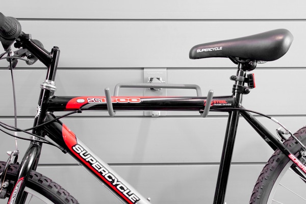 Folding Bike Hook. FBIKERK-L. The ultimate space saver. Keep your bicycle off the floor and easily accessible, no awkward reaching! When not in use the hook collapses neatly against the wall with the push of a button. The bicycle must have a horizontal beam in order to be used with this rack.